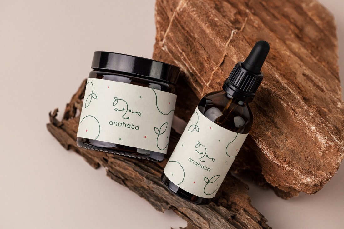 Anahata jar and dropper bottle on bark