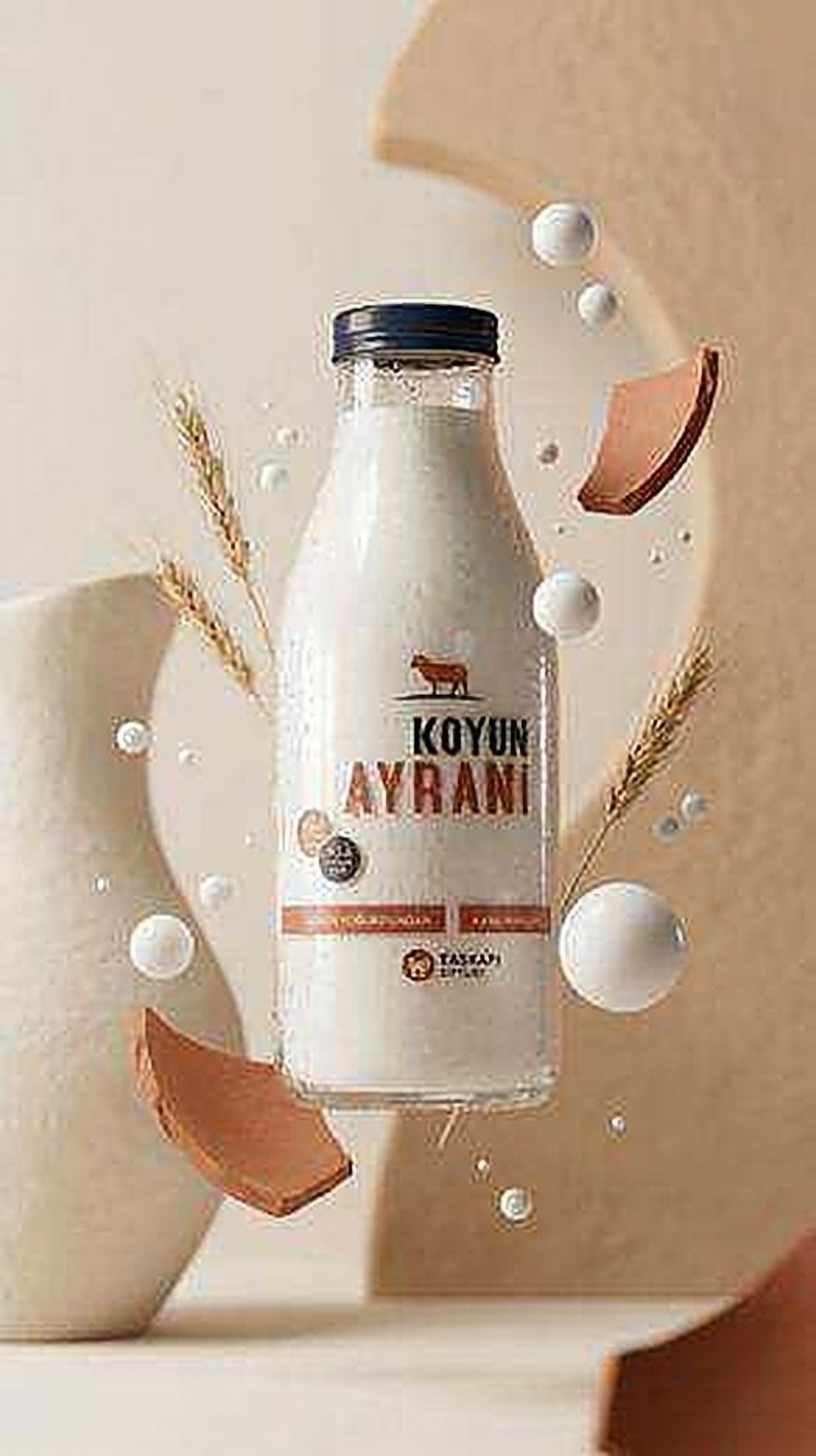 Taşkapı Çiftliği ayran bottle floating among wheat stalks and terracotta shards
